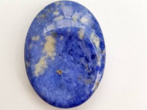 Highly polished Sodalite thumb stone 40 x 30 mm. The thumb stones have been designed to have a pleasing feel with the highest quality finish. They are shaped to fit beautifully between the thumb and fingers. Being a natural product these stones may have natural blemishes and vary in colour and banding. www.naturalhealingshop.co.uk based in Nuneaton for crystals, spiritual healing, meditation, relaxation, spiritual development,workshops.