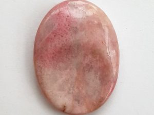 Highly polished Rhodonite thumb stone 40 x 30 mm. The thumb stones have been designed to have a pleasing feel with the highest quality finish. They are shaped to fit beautifully between the thumb and fingers. Being a natural product these stones may have natural blemishes and vary in colour and banding. www.naturalhealingshop.co.uk based in Nuneaton for crystals, spiritual healing, meditation, relaxation, spiritual development,workshops.