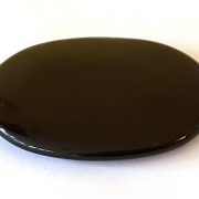 Highly polished Black Obsidian palm stone 70 x 40 mm. The palm stones are made from the best grade rough materials to produce a well finished, highly polished product. Used by crystal healers and general therapists for massage and similar treatments. Also perfect for collectors. Being a natural product these stones may have natural blemishes and vary in colour and banding. www.naturalhealingshop.co.uk based in Nuneaton for crystals, spiritual healing, meditation, relaxation, spiritual development,workshops.