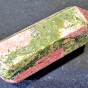 Highly polished Unakite Wand wand approximate height 55 mm Used in crystal healing and meditation. Excellent for collectors. Being a natural product this crystal may have natural blemishes and vary in colour. www.naturalhealingshop.co.uk based in Nuneaton for crystals, spiritual healing, meditation, relaxation, spiritual development,workshops.