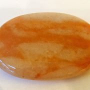 Highly polished Aventurine Peach palm stone 70 x 40 mm. The palm stones are made from the best grade rough materials to produce a well finished, highly polished product. Used by crystal healers and general therapists for massage and similar treatments. Also perfect for collectors. Being a natural product these stones may have natural blemishes and vary in colour and banding. www.naturalhealingshop.co.uk based in Nuneaton for crystals, spiritual healing, meditation, relaxation, spiritual development,workshops.