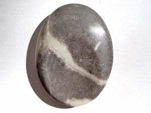 Highly polished shell jasper thumb stone 40 x 30 mm. The thumb stones have been designed to have a pleasing feel with the highest quality finish. They are shaped to fit beautifully between the thumb and fingers. Being a natural product these stones may have natural blemishes and vary in colour and banding. www.naturalhealingshop.co.uk based in Nuneaton for crystals, spiritual healing, meditation, relaxation, spiritual development,workshops.