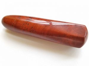 Highly polished Red Jasper wand approximate height 100 mm Used in crystal healing and meditation. Excellent for collectors. Being a natural product this crystal may have natural blemishes and vary in colour. www.naturalhealingshop.co.uk based in Nuneaton for crystals, spiritual healing, meditation, relaxation, spiritual development,workshops.