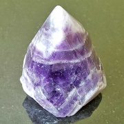 Highly polished Amethyst Chevron Point approximate height 55 mm. Being a natural product this crystal may have natural blemishes and vary in colour. www.naturalhealingshop.co.uk based in Nuneaton for crystals, spiritual healing, meditation, relaxation, spiritual development,workshops.