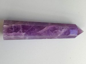 Amethyst polished point with cut base approx height 95 mm. Diameter 20 mm. Being a natural product the crystal may have natural blemishes and vary in colour. www.naturalhealingshop.co.uk based in Nuneaton for crystals, spiritual healing, meditation, relaxation, spiritual development,workshops.