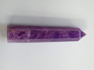 Amethyst polished point with cut base approx height 105 mm. Diameter 20 mm. Being a natural product the crystal may have natural blemishes and vary in colour. www.naturalhealingshop.co.uk based in Nuneaton for crystals, spiritual healing, meditation, relaxation, spiritual development,workshops.