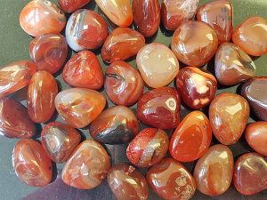 Highly polished Red Carnelian tumble stone size 2-3 cm Being a natural product this crystal may have natural blemishes and vary in colour. www.naturalhealingshop.co.uk based in Nuneaton for crystals, spiritual healing, meditation, relaxation, spiritual development,workshops.