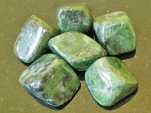 Highly polished Diopside tumble stone size 2.5-3 cm Being a natural product this crystal may have natural blemishes and vary in colour. www.naturalhealingshop.co.uk based in Nuneaton for crystals, spiritual healing, meditation, relaxation, spiritual development,workshops.