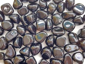 Highly polished Black Onyx tumble stone size 2-3 cm. Being a natural product these stones may have natural blemishes and vary in colour, banding and shape. See photograph. www.naturalhealingshop.co.uk based in Nuneaton for crystals, spiritual healing, meditation, relaxation, spiritual development,workshops.