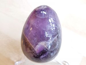 Highly polished Chevron Amethyst crystal egg approximate height 45 mm. Beautiful to collect or hold and meditate with. Being a natural product these stones may have natural blemishes and vary in colour and banding. www.naturalhealingshop.co.uk based in Nuneaton for crystals, spiritual healing, meditation, relaxation, spiritual development,workshops.
