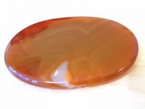 Highly polished Carnelian palm stone 70 x 40 mm. The palm stones are made from the best grade rough materials to produce a well finished, highly polished product. Used by crystal healers and general therapists for massage and similar treatments. Also perfect for collectors. Being a natural product these stones may have natural blemishes and vary in colour and banding. www.naturalhealingshop.co.uk based in Nuneaton for crystals, spiritual healing, meditation, relaxation, spiritual development,workshops.