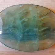 Highly polished Fluorite palm stone 70 x 40 mm. The palm stones are made from the best grade rough materials to produce a well finished, highly polished product. Used by crystal healers and general therapists for massage and similar treatments. Also perfect for collectors. Being a natural product these stones may have natural blemishes and vary in colour and banding. www.naturalhealingshop.co.uk based in Nuneaton for crystals, spiritual healing, meditation, relaxation, spiritual development,workshops.