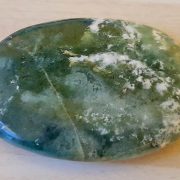 Highly polished Moss Agate palm stone 70 x 40 mm. The palm stones are made from the best grade rough materials to produce a well finished, highly polished product. Used by crystal healers and general therapists for massage and similar treatments. Also perfect for collectors. Being a natural product these stones may have natural blemishes and vary in colour and banding. www.naturalhealingshop.co.uk based in Nuneaton for crystals, spiritual healing, meditation, relaxation, spiritual development,workshops.