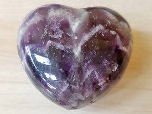 Highly polished Amethyst Chevron Heart approx 45 mm. These hearts are perfect for a gift! There are purple velvet pouches or organza bags you can purchase to pop them into for the finishing touch. Being a natural product these stones may have natural blemishes and vary in colour and banding. www.naturalhealingshop.co.uk based in Nuneaton for crystals, spiritual healing, meditation, relaxation, spiritual development,workshops.