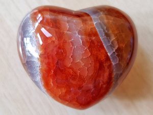 Highly polished Fire Agate Heart approx 45 mm. These hearts are perfect for a gift! There are purple velvet pouches or organza bags you can purchase to pop them into for the finishing touch. Being a natural product these stones may have natural blemishes and vary in colour and banding. www.naturalhealingshop.co.uk based in Nuneaton for crystals, spiritual healing, meditation, relaxation, spiritual development,workshops.