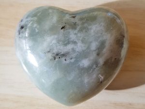 Highly polished New Jade Heart approx 45 mm. These hearts are perfect for a gift! There are purple velvet pouches or organza bags you can purchase to pop them into for the finishing touch. Being a natural product these stones may have natural blemishes and vary in colour and banding. www.naturalhealingshop.co.uk based in Nuneaton for crystals, spiritual healing, meditation, relaxation, spiritual development,workshops.