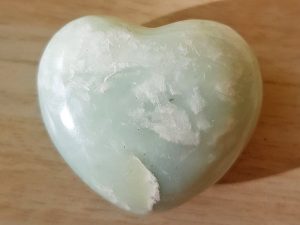 Highly polished New Jade Heart approx 45 mm. These hearts are perfect for a gift! There are purple velvet pouches or organza bags you can purchase to pop them into for the finishing touch. Being a natural product these stones may have natural blemishes and vary in colour and banding. www.naturalhealingshop.co.uk based in Nuneaton for crystals, spiritual healing, meditation, relaxation, spiritual development,workshops.
