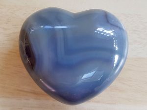 Highly polished Agate Heart approx 45 mm. These hearts are perfect for a gift! There are purple velvet pouches or organza bags you can purchase to pop them into for the finishing touch. Being a natural product these stones may have natural blemishes and vary in colour and banding. www.naturalhealingshop.co.uk based in Nuneaton for crystals, spiritual healing, meditation, relaxation, spiritual development,workshops.