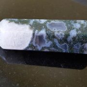 Highly polished Moss Agate wand approximate height 70 mm Used in crystal healing and meditation. Excellent for collectors. Being a natural product this crystal may have natural blemishes and vary in colour. www.naturalhealingshop.co.uk based in Nuneaton for crystals, spiritual healing, meditation, relaxation, spiritual development,workshops.