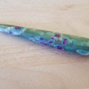 Highly polished Ruby Fuschite wand approximate height 100 mm Used in crystal healing and meditation. Excellent for collectors. Being a natural product this crystal may have natural blemishes and vary in colour. www.naturalhealingshop.co.uk based in Nuneaton for crystals, spiritual healing, meditation, relaxation, spiritual development,workshops.
