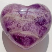 Highly polished Chevron Amethyst Heart approx 45 mm. These hearts are perfect for a gift! There are purple velvet pouches or organza bags you can purchase to pop them into for the finishing touch. Being a natural product these stones may have natural blemishes and vary in colour and banding. www.naturalhealingshop.co.uk based in Nuneaton for crystals, spiritual healing, meditation, relaxation, spiritual development,workshops.