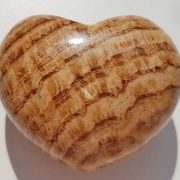 Highly polished Aragonite Heart approx 45 mm. These hearts are perfect for a gift! There are purple velvet pouches or organza bags you can purchase to pop them into for the finishing touch. Being a natural product these stones may have natural blemishes and vary in colour and banding. www.naturalhealingshop.co.uk based in Nuneaton for crystals, spiritual healing, meditation, relaxation, spiritual development,workshops.