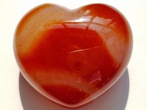 Highly polished Carnelian Heart approx 45 mm. These hearts are perfect for a gift! There are purple velvet pouches or organza bags you can purchase to pop them into for the finishing touch. Being a natural product these stones may have natural blemishes and vary in colour and banding. www.naturalhealingshop.co.uk based in Nuneaton for crystals, spiritual healing, meditation, relaxation, spiritual development,workshops.