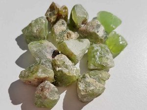 Rough Peridot sizes approx 10 - 15 mm. Being a natural product this crystal may have natural blemishes and vary in colour and banding. www.naturalhealingshop.co.uk based in Nuneaton for crystals, spiritual healing, meditation, relaxation, spiritual development,workshops.