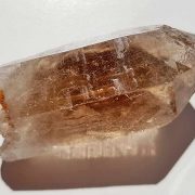 Rough Smoky Quartz point approximate length 65 mm. Being a natural product this crystal may have natural blemishes and vary in colour and banding. www.naturalhealingshop.co.uk based in Nuneaton for crystals, spiritual healing, meditation, relaxation, spiritual development,workshops.