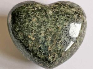 Highly polished Preseli Bluestone Heart approx 45 mm. These hearts are perfect for a gift! There are purple velvet pouches or organza bags you can purchase to pop them into for the finishing touch. Being a natural product these stones may have natural blemishes and vary in colour and banding. www.naturalhealingshop.co.uk based in Nuneaton for crystals, spiritual healing, meditation, relaxation, spiritual development,workshops.