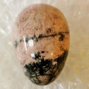 Highly polished Rhodonite egg approx height 45 mm. www.naturalhealingshop.co.uk based in Nuneaton for crystals, spiritual healing, meditation, relaxation, spiritual development,workshops.