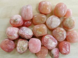 Highly polished Rose Opal tumble stone size 20 to 30 mm. Being a natural product this crystal may have natural blemishes and vary in colour. www.naturalhealingshop.co.uk based in Nuneaton for crystals, spiritual healing, meditation, relaxation, spiritual development,workshops.