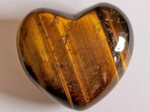 Highly polished Golden Tigers Eye Heart approx 45 mm. These hearts are perfect for a gift! There are purple velvet pouches or organza bags you can purchase to pop them into for the finishing touch. Being a natural product these stones may have natural blemishes and vary in colour and banding. www.naturalhealingshop.co.uk based in Nuneaton for crystals, spiritual healing, meditation, relaxation, spiritual development,workshops.