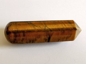 Highly polished Tiger Eye wand approximate height 70 mm Used in crystal healing and meditation. Excellent for collectors. www.naturalhealingshop.co.uk based in Nuneaton for crystals, spiritual healing, meditation, relaxation, spiritual development,workshops.