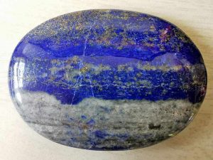 Highly polished Lapis Lazuli comfort stone approx size 60 x 43 mm Being a natural product this crystal may have natural blemishes and vary in colour and banding. www.naturalhealingshop.co.uk based in Nuneaton for crystals, spiritual healing, meditation, relaxation, spiritual development,workshops.