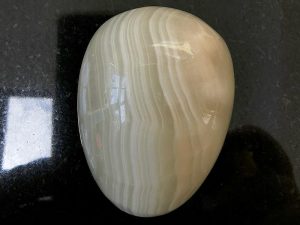 Highly polished onyx egg approximate height 45 mm. Beautiful to collect or hold and meditate with. Being a natural product these stones may have natural blemishes and vary in colour and banding. www.naturalhealingshop.co.uk based in Nuneaton for crystals, spiritual healing, meditation, relaxation, spiritual development,workshops.