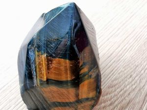 Highly polished Tigers Eye Blue point approximate height 60 mm. Being a natural product this crystal may have natural blemishes and vary in colour. www.naturalhealingshop.co.uk based in Nuneaton for crystals, spiritual healing, meditation, relaxation, spiritual development,workshops.