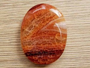 Highly polished fire Agate thumb stone 40 x 30 mm. The thumb stones have been designed to have a pleasing feel with the highest quality finish. They are shaped to fit beautifully between the thumb and fingers. Being a natural product these stones may have natural blemishes and vary in colour and banding. www.naturalhealingshop.co.uk based in Nuneaton for crystals, spiritual healing, meditation, relaxation, spiritual development,workshops.
