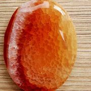 Highly polished fire Agate thumb stone 40 x 30 mm. The thumb stones have been designed to have a pleasing feel with the highest quality finish. They are shaped to fit beautifully between the thumb and fingers. Being a natural product these stones may have natural blemishes and vary in colour and banding. www.naturalhealingshop.co.uk based in Nuneaton for crystals, spiritual healing, meditation, relaxation, spiritual development,workshops.