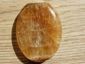 Highly polished Aragonite thumb stone 40 x 30 mm. The thumb stones have been designed to have a pleasing feel with the highest quality finish. They are shaped to fit beautifully between the thumb and fingers. Being a natural product these stones may have natural blemishes and vary in colour and banding. www.naturalhealingshop.co.uk based in Nuneaton for crystals, spiritual healing, meditation, relaxation, spiritual development,workshops.