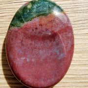 Highly polished Bloodstone thumb stone 40 x 30 mm. The thumb stones have been designed to have a pleasing feel with the highest quality finish. They are shaped to fit beautifully between the thumb and fingers. Being a natural product these stones may have natural blemishes and vary in colour and banding. www.naturalhealingshop.co.uk based in Nuneaton for crystals, spiritual healing, meditation, relaxation, spiritual development,workshops.
