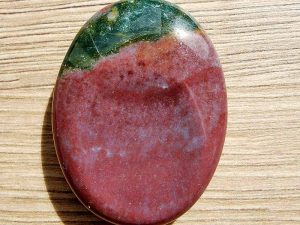 Highly polished Bloodstone thumb stone 40 x 30 mm. The thumb stones have been designed to have a pleasing feel with the highest quality finish. They are shaped to fit beautifully between the thumb and fingers. Being a natural product these stones may have natural blemishes and vary in colour and banding. www.naturalhealingshop.co.uk based in Nuneaton for crystals, spiritual healing, meditation, relaxation, spiritual development,workshops.