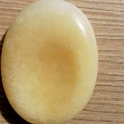 Highly polished orange calcite thumb stone 40 x 30 mm. The thumb stones have been designed to have a pleasing feel with the highest quality finish. They are shaped to fit beautifully between the thumb and fingers. Being a natural product these stones may have natural blemishes and vary in colour and banding. www.naturalhealingshop.co.uk based in Nuneaton for crystals, spiritual healing, meditation, relaxation, spiritual development,workshops.