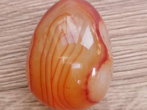 Highly polished Carnelian egg approximate height 45 mm. Beautiful to collect or hold and meditate with. Being a natural product these stones may have natural blemishes and vary in colour and banding. www.naturalhealingshop.co.uk based in Nuneaton for crystals, spiritual healing, meditation, relaxation, spiritual development,workshops.