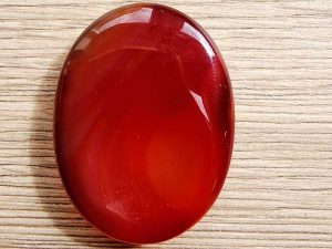 Highly polished Carnelian thumb stone 40 x 30 mm. The thumb stones have been designed to have a pleasing feel with the highest quality finish. They are shaped to fit beautifully between the thumb and fingers. Being a natural product these stones may have natural blemishes and vary in colour and banding. www.naturalhealingshop.co.uk based in Nuneaton for crystals, spiritual healing, meditation, relaxation, spiritual development,workshops.