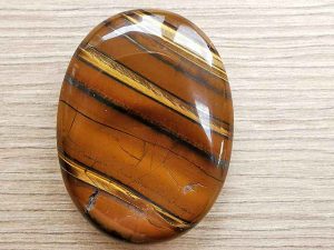 Highly polished tiger jasper thumb stone 40 x 30 mm. The thumb stones have been designed to have a pleasing feel with the highest quality finish. They are shaped to fit beautifully between the thumb and fingers. Being a natural product these stones may have natural blemishes and vary in colour and banding. www.naturalhealingshop.co.uk based in Nuneaton for crystals, spiritual healing, meditation, relaxation, spiritual development,workshops.