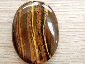 Highly polished tiger jasper thumb stone 40 x 30 mm. The thumb stones have been designed to have a pleasing feel with the highest quality finish. They are shaped to fit beautifully between the thumb and fingers. Being a natural product these stones may have natural blemishes and vary in colour and banding. www.naturalhealingshop.co.uk based in Nuneaton for crystals, spiritual healing, meditation, relaxation, spiritual development,workshops.