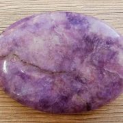 Highly polished Lepidolite palm stone 70 x 40 mm. The palm stones are made from the best grade rough materials to produce a well finished, highly polished product. Used by crystal healers and general therapists for massage and similar treatments. Also perfect for collectors. Being a natural product these stones may have natural blemishes and vary in colour and banding. www.naturalhealingshop.co.uk based in Nuneaton for crystals, spiritual healing, meditation, relaxation, spiritual development,workshops.