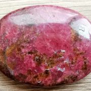 Highly polished rhodonite palm stone 70 x 40 mm. The palm stones are made from the best grade rough materials to produce a well finished, highly polished product. Used by crystal healers and general therapists for massage and similar treatments. Also perfect for collectors. Being a natural product these stones may have natural blemishes and vary in colour and banding. www.naturalhealingshop.co.uk based in Nuneaton for crystals, spiritual healing, meditation, relaxation, spiritual development,workshops.