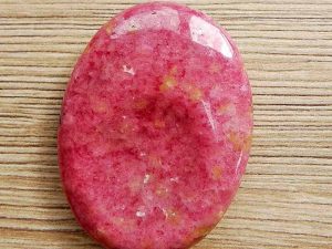 Highly polished Rhodonite thumb stone 40 x 30 mm. The thumb stones have been designed to have a pleasing feel with the highest quality finish. They are shaped to fit beautifully between the thumb and fingers. Being a natural product these stones may have natural blemishes and vary in colour and banding. www.naturalhealingshop.co.uk based in Nuneaton for crystals, spiritual healing, meditation, relaxation, spiritual development,workshops.